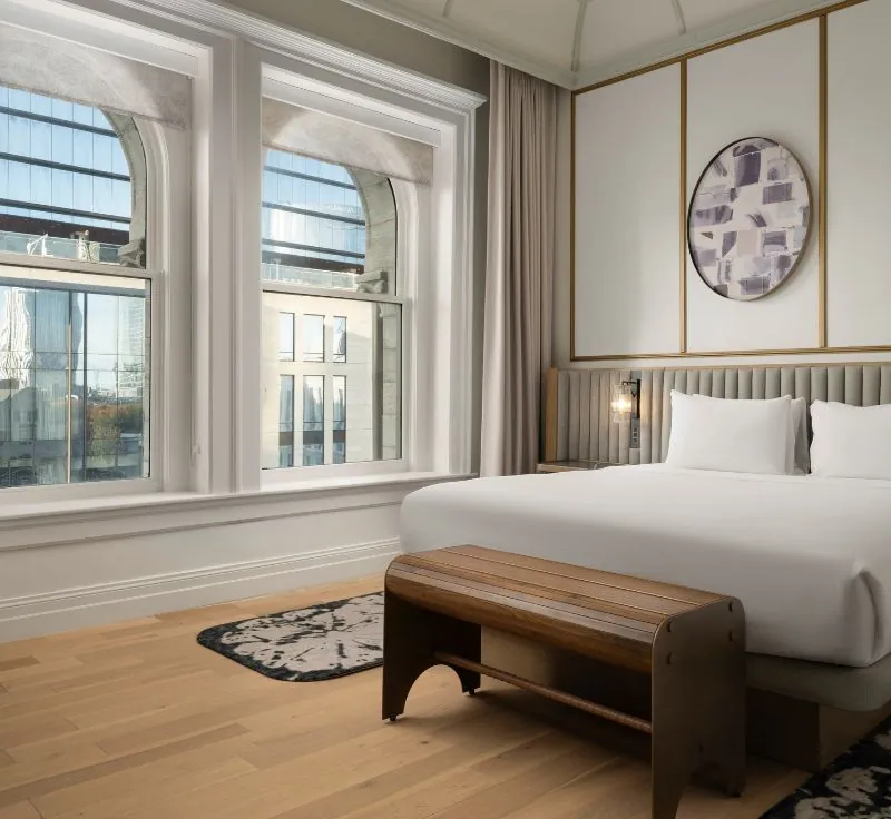 King room with large windows and city views