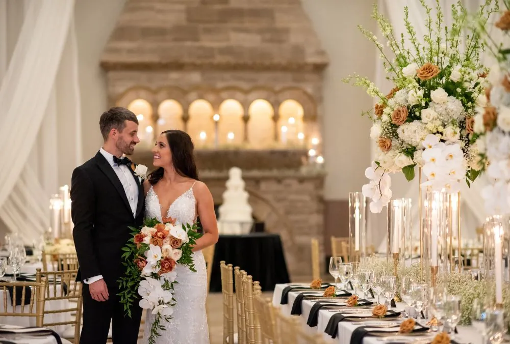 Groom and bride in front of wedding setting