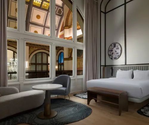 Hotel room with a king-size bed, with views of the Union Station Hotel interior