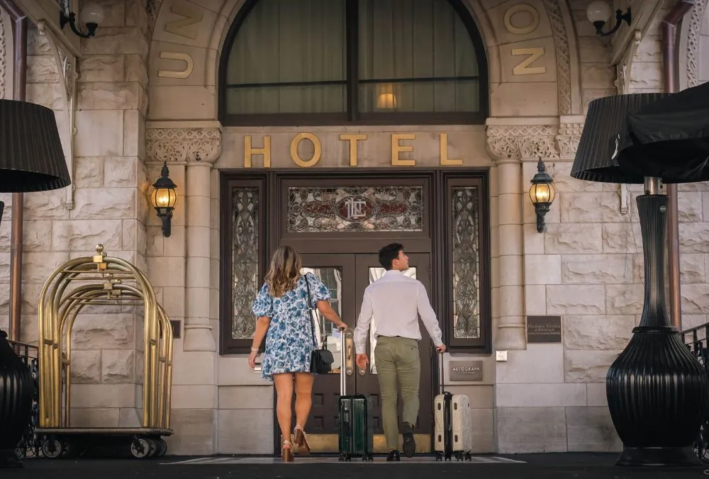 Couple entering the Union Station Hotel with luggage