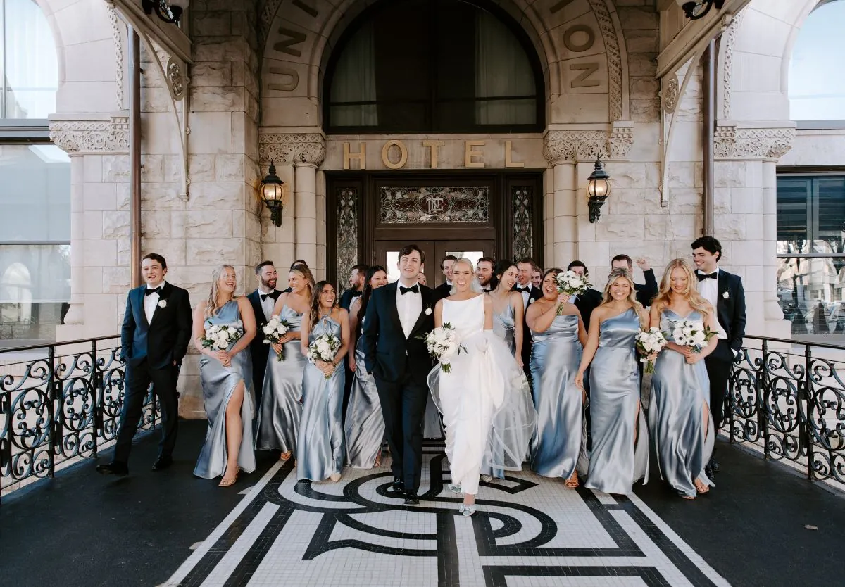 Bride and groom with bridesmaids in front of Union Station Hotel